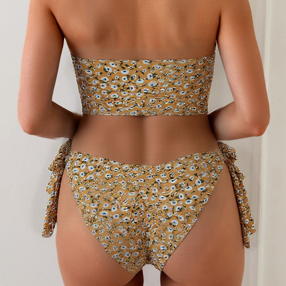 Women's split swimsuit with ruffled top and floral print for vacation and beach